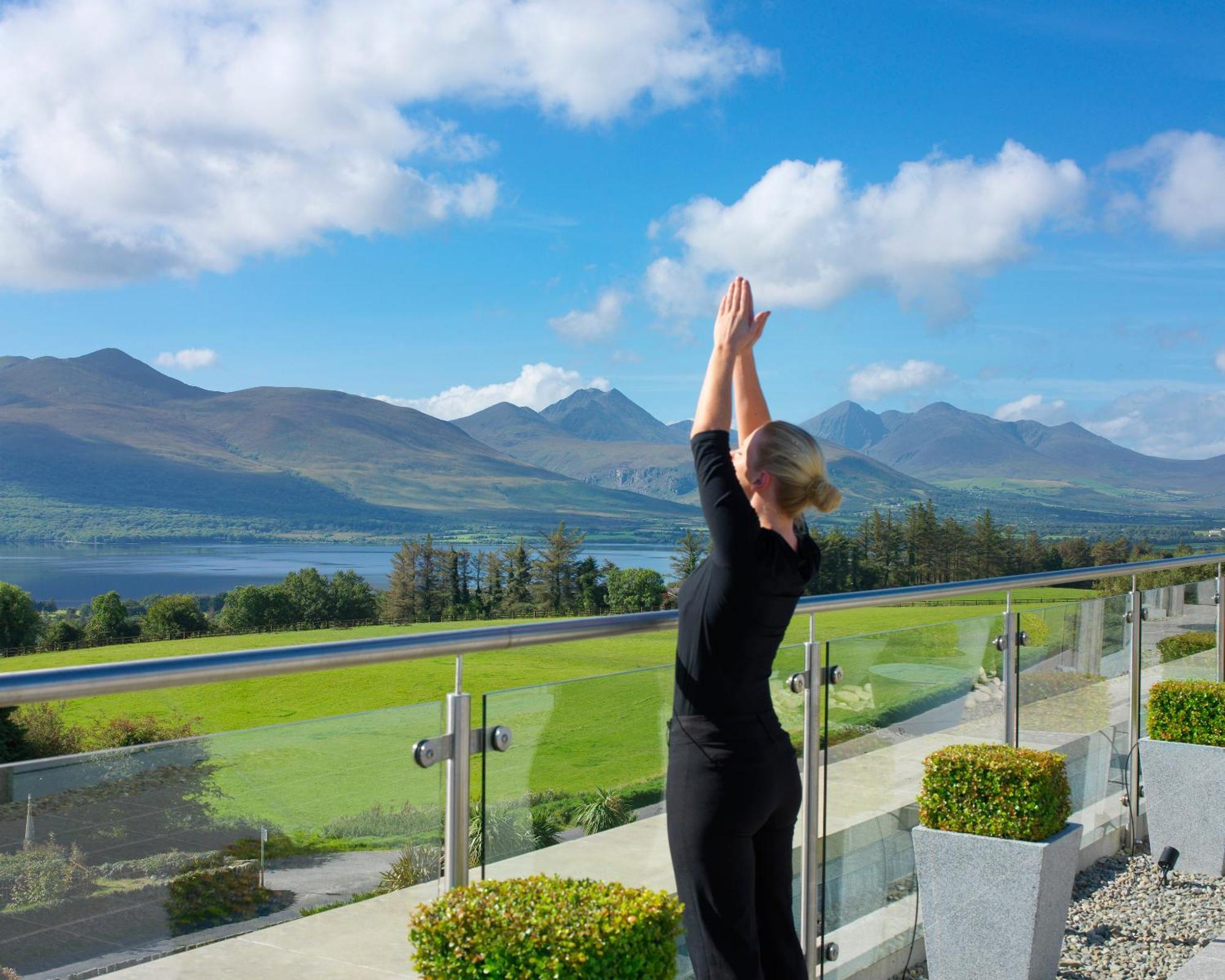 Aghadoe Heights Hotel & Spa Killarney Exterior photo A woman practicing yoga at the Ice House Hotel
